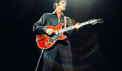 Elvis Presley playing the guitar