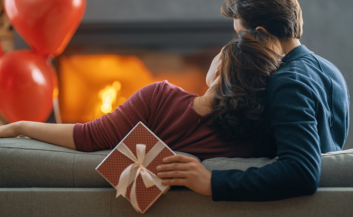 A happy couple exchanging thoughtful gifts, celebrating love and appreciation on Valentine's Day.